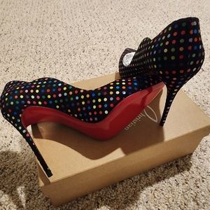 Christian Louboutin Paris (Red Bottoms)